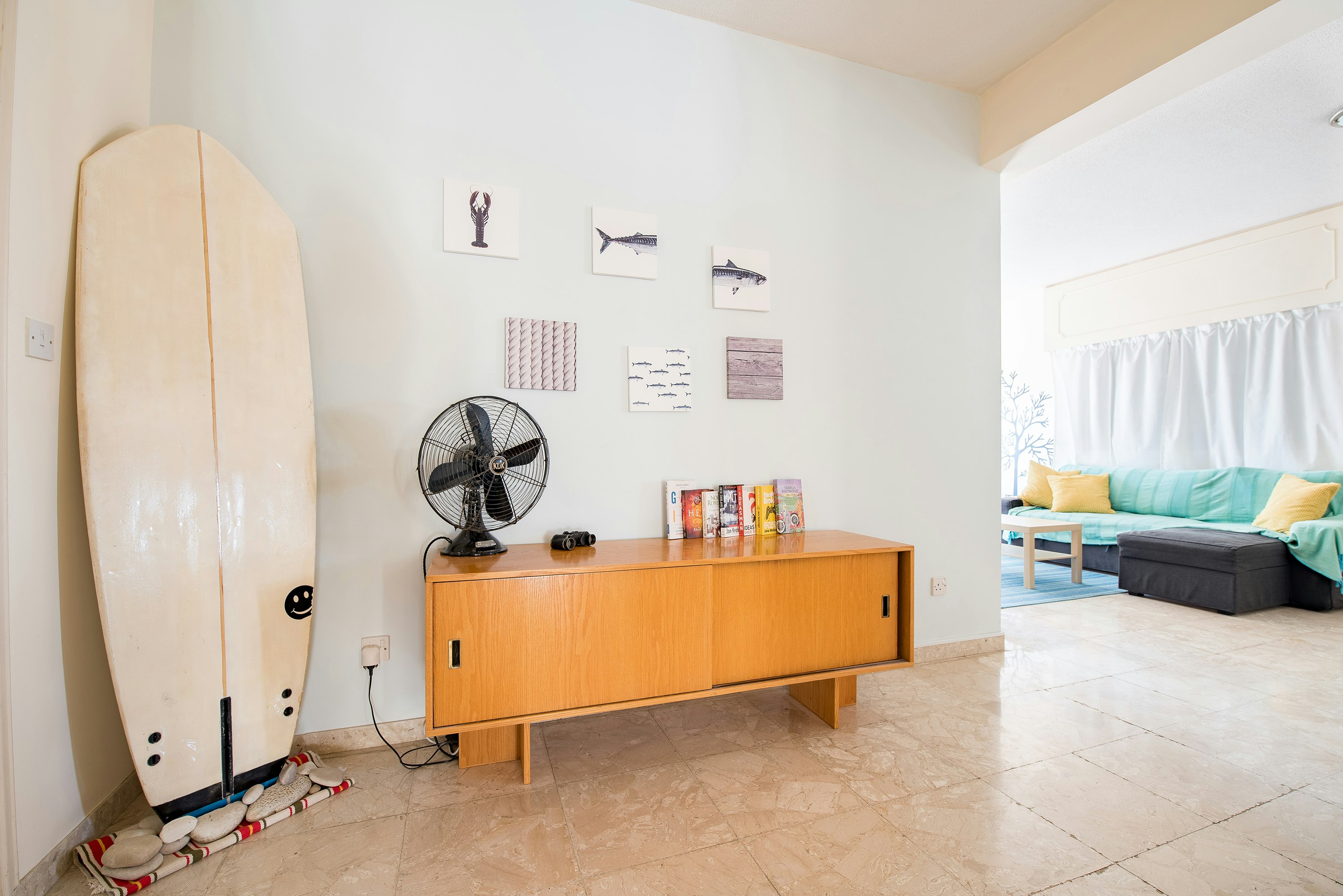 desk fan on credenza beside wall